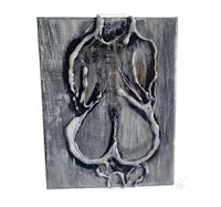 a painting of a woman's torso on a piece of wood